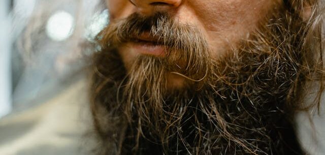https://www.pexels.com/photo/close-up-shot-of-a-bearded-man-8078490/ bearded man