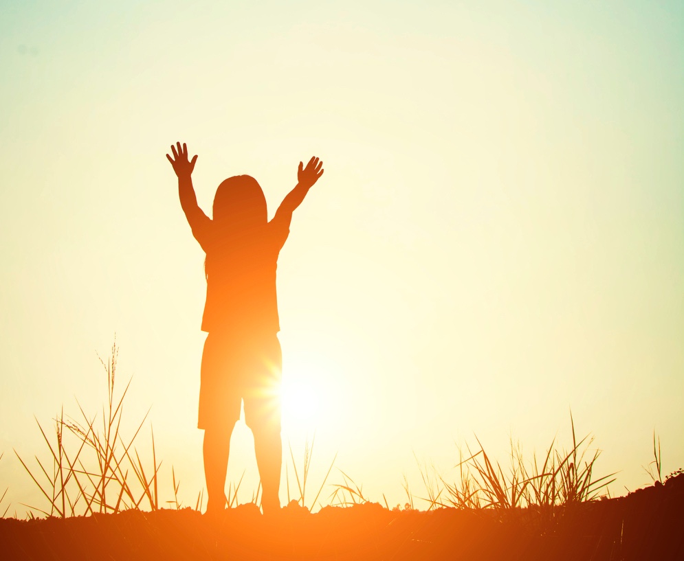 Boy's silhouette at sunset