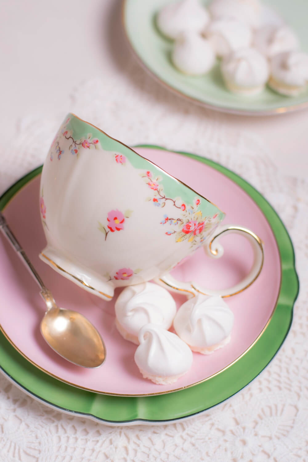 pink tea cup, spoon and candy